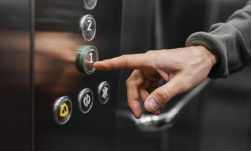 delivery-man-with-package-elevator-close-up